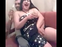 Arab white woman dancing for a friend while watching the man